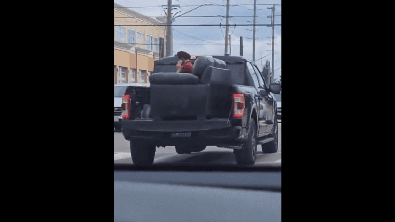 VIDEO: Man on couch seen in back of moving truck in Brampton